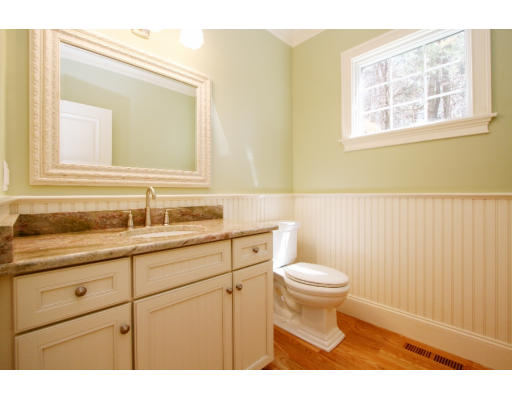 133 Shade Street Lexington, MA 02421 - Photo 9 of 21 a bathroom with a sink a toilet and a mirror