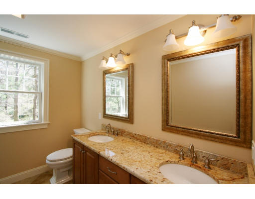 133 Shade Street Lexington, MA 02421 - Photo 10 of 21 a bathroom with a granite countertop sink toilet a mirror and a window