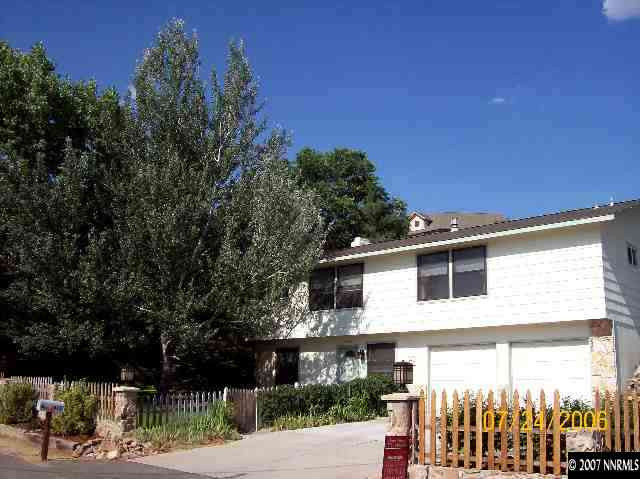 14475 Huron Trail Reno, NV 89521 - Photo 1 of 9 a view of a house with a yard