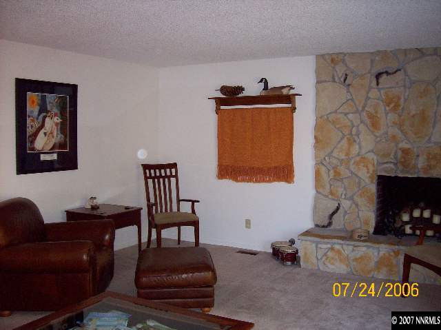 14475 Huron Trail Reno, NV 89521 - Photo 9 of 9 a living room with furniture and a fireplace