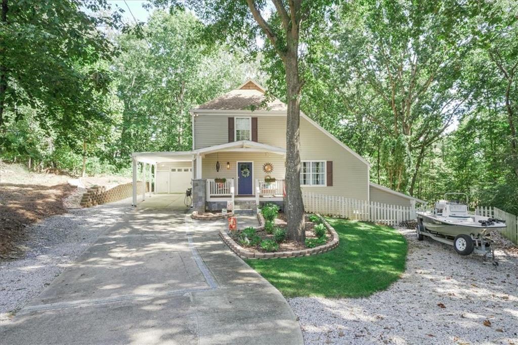 9050 Pine Tree Circle Gainesville, GA 30506 - Photo 1 of 1 a front view of a house with garden