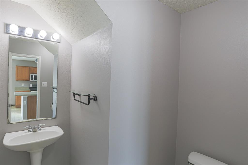 149 Independence Avenue Venus, TX 76084 - Photo 5 of 27 a bathroom with a sink a toilet and shower