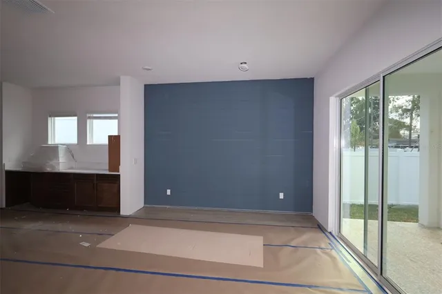 a view of an empty room with a window