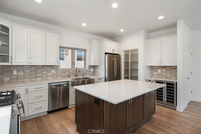 a kitchen with a stove and a white cabinet