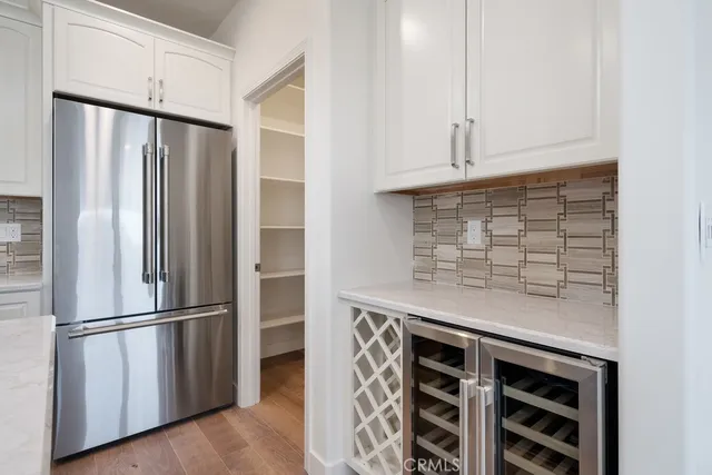 a spacious bathroom with a granite countertop sink a mirror and a