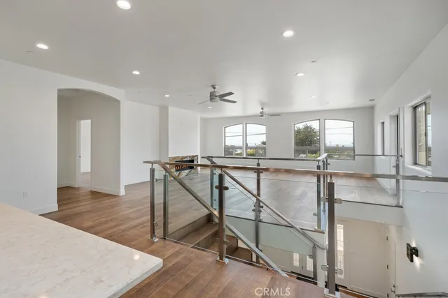 a bathroom with a bathtub a double vanity sink and mirror