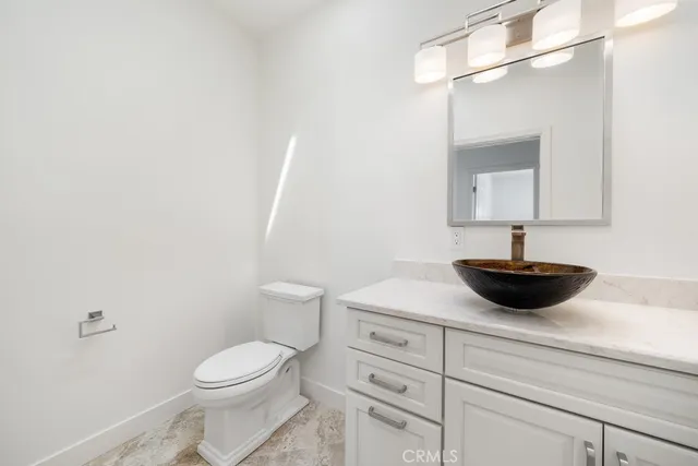 a bathroom with a shower toilet sink and mirror