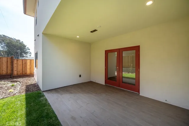 a view of backyard with wooden fence