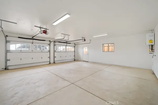 a view of a town with mountains in the background