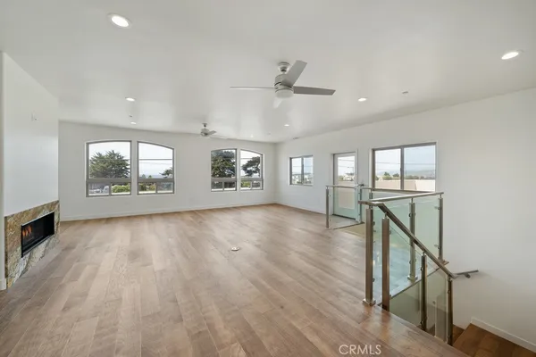 a view of a living room and a floor to ceiling window
