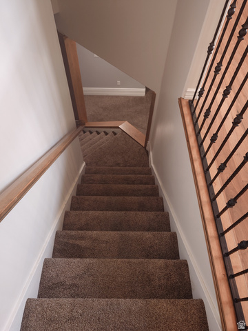 552 Sunset Crest Way Draper, UT 84020 - Photo 44 of 68 Stairs with carpet and baseboards