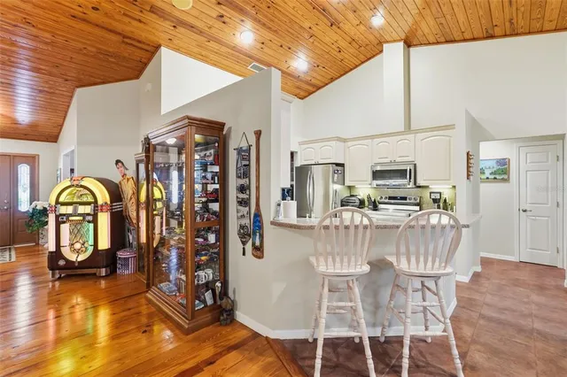 a kitchen with a faucet a sink and chandelier