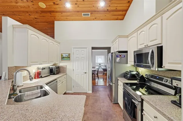 a living room with furniture and a bookshelf