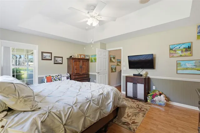 a work room with furniture and a flat screen tv