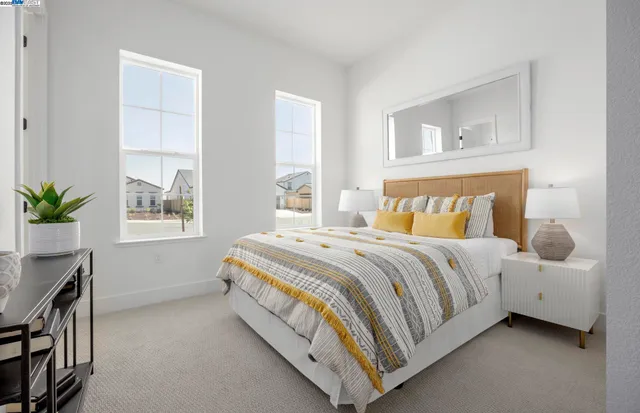 a bedroom with a bed and window