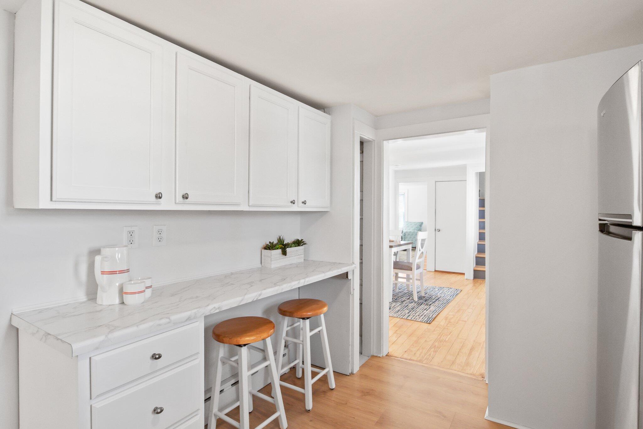 7 Spruce Street Fairhaven, MA 02719 - Photo 13 of 30 a kitchen with stainless steel appliances granite countertop a refrigerator and a stove top oven