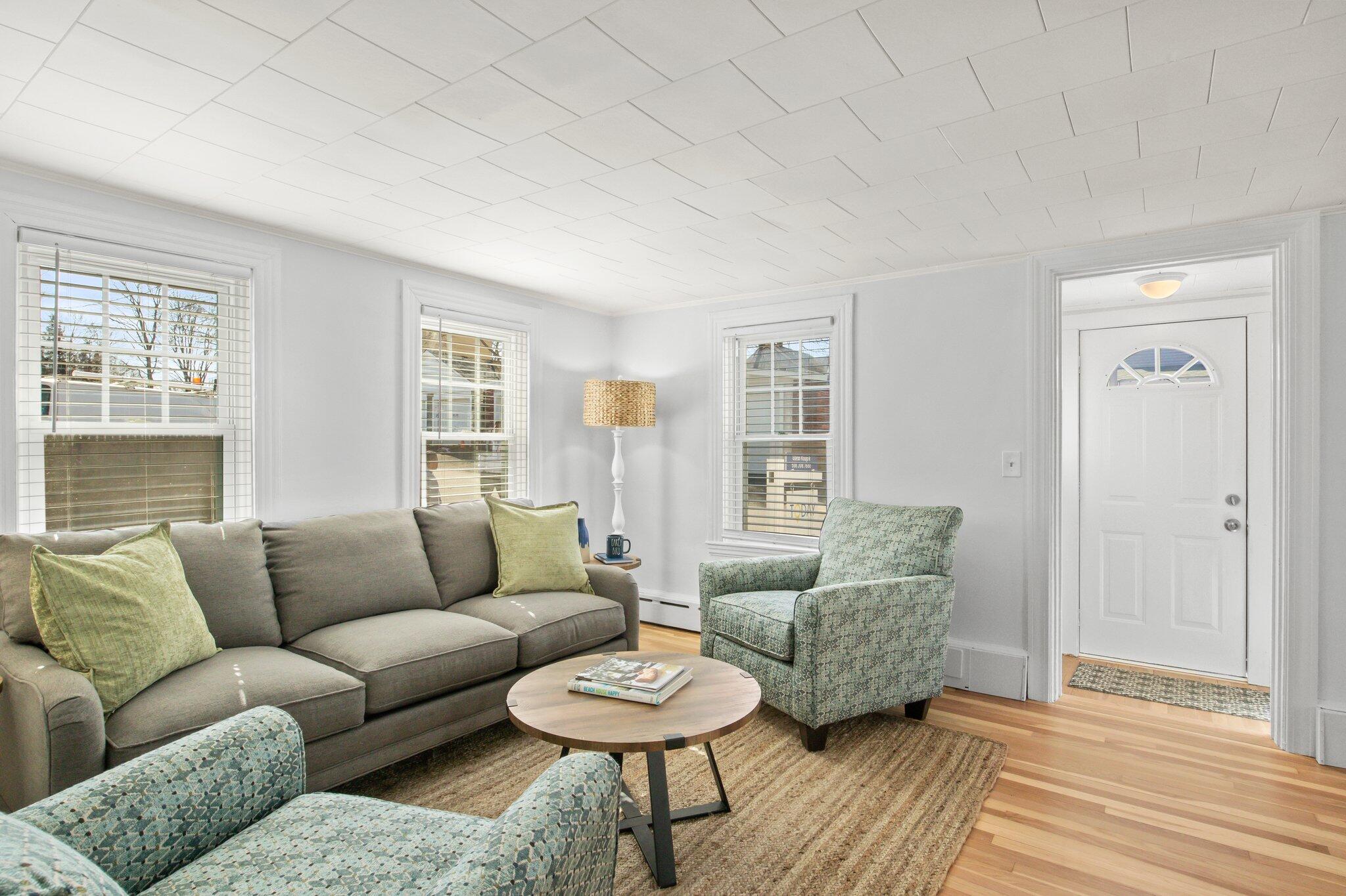 7 Spruce Street Fairhaven, MA 02719 - Photo 3 of 30 a living room with furniture and a wooden floor