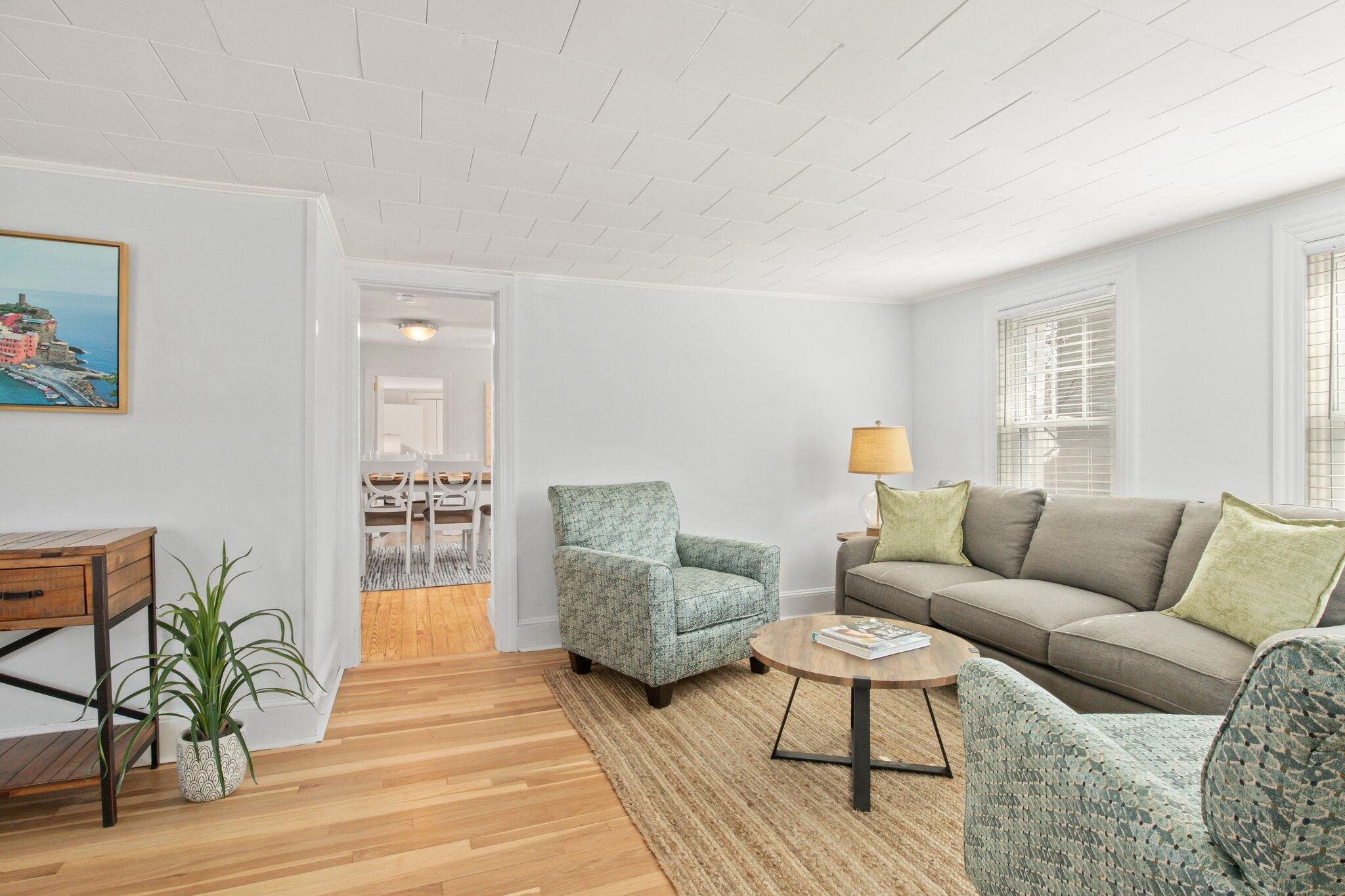 7 Spruce Street Fairhaven, MA 02719 - Photo 4 of 30 a living room with furniture and a wooden floor