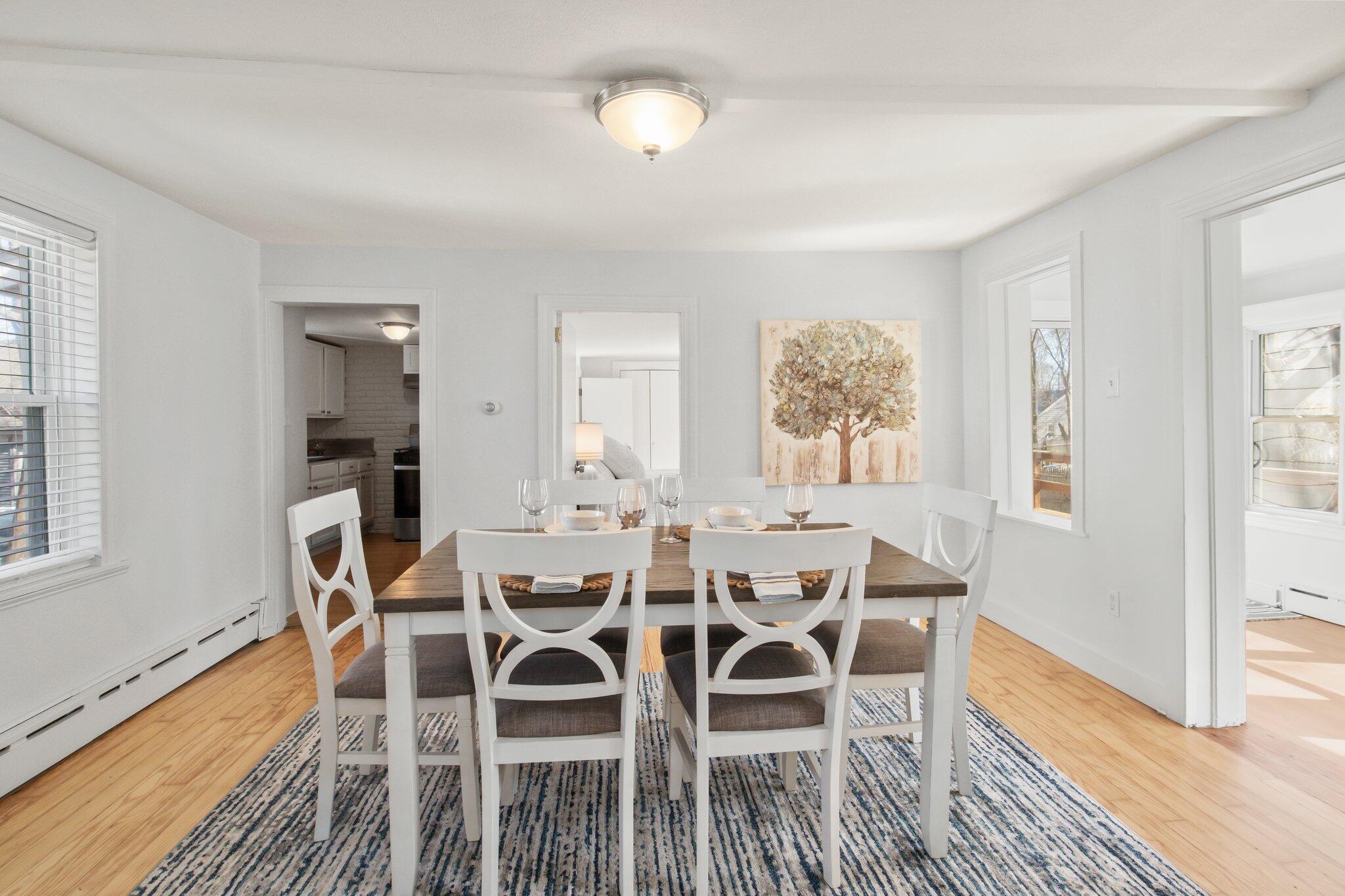 7 Spruce Street Fairhaven, MA 02719 - Photo 8 of 30 a dining room with furniture a chandelier and wooden floor