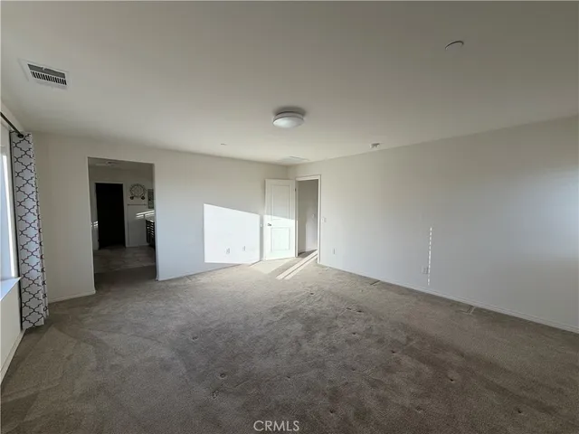 a spacious bathroom with a bathtub and a shower