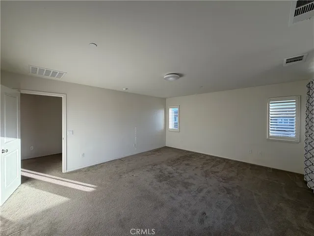 a large bathroom with a double vanity sink and mirror with shower