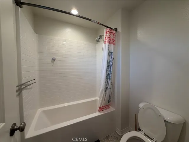 an empty room with a empty space and windows