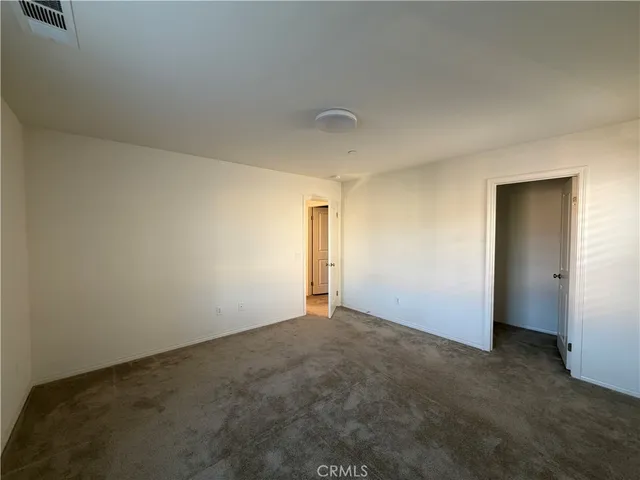 a view of a porch with furniture and a yard