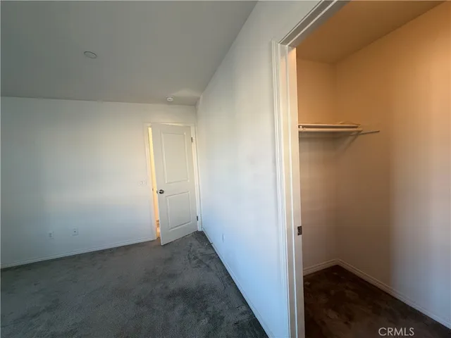 a view of a patio with a table and chairs and potted plants