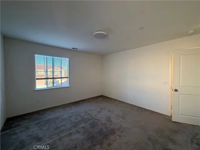 a view of a house with a potted plant ana