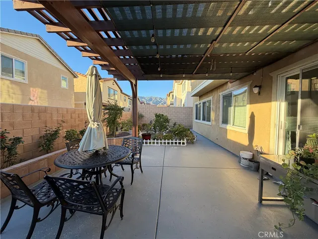 a view of a street with wooden fence