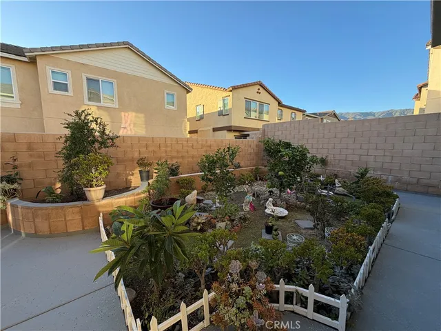 a view of patio with a table and chairs