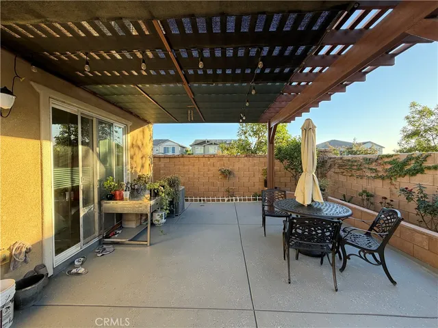 a view of backyard with plants and outdoor seating