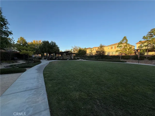 a view of a patio with table and chairs and potted plants
