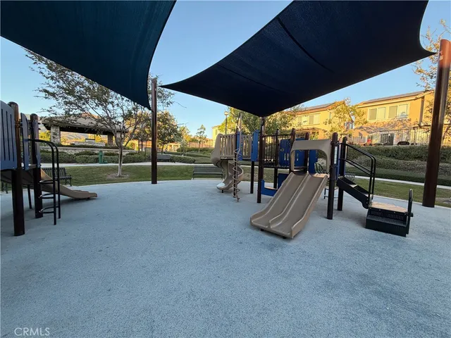 a view of a porch with furniture and a yard
