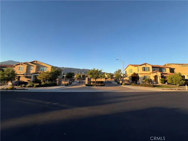 a front view of house with yard and trees