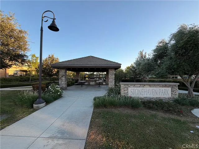 a view of house with garden space and trees