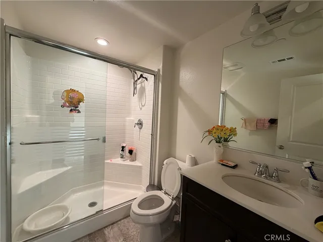 a view of a hallway to the room