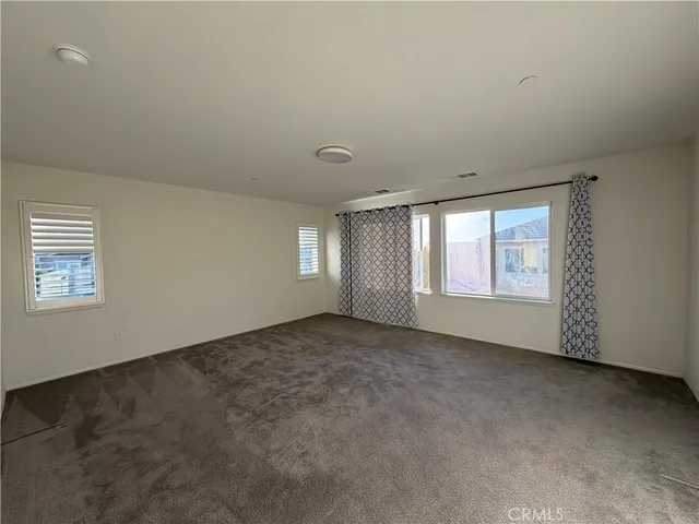 a spacious bathroom with a double vanity sink toilet and shower