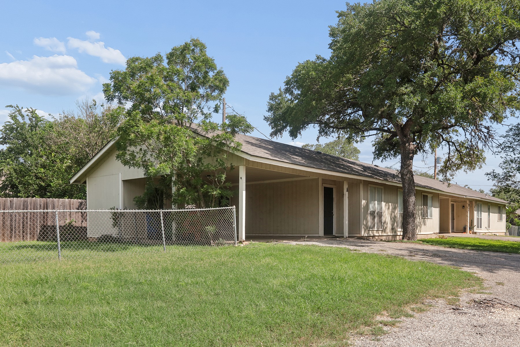 3114 Plantation Road, Unit A Austin, TX 78745 - Photo 1 of 15 A well-maintained facade with mature trees provides ample shade to this charming residence.