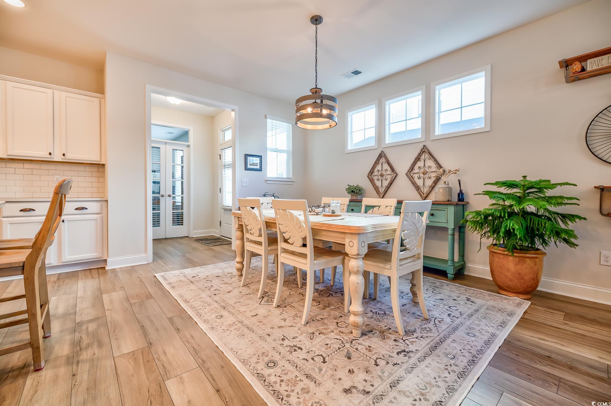 2052 Silver Island Way Murrells Inlet, SC 29576 - Photo 23 of 24 Dining room featuring light wood finished floors and baseboards