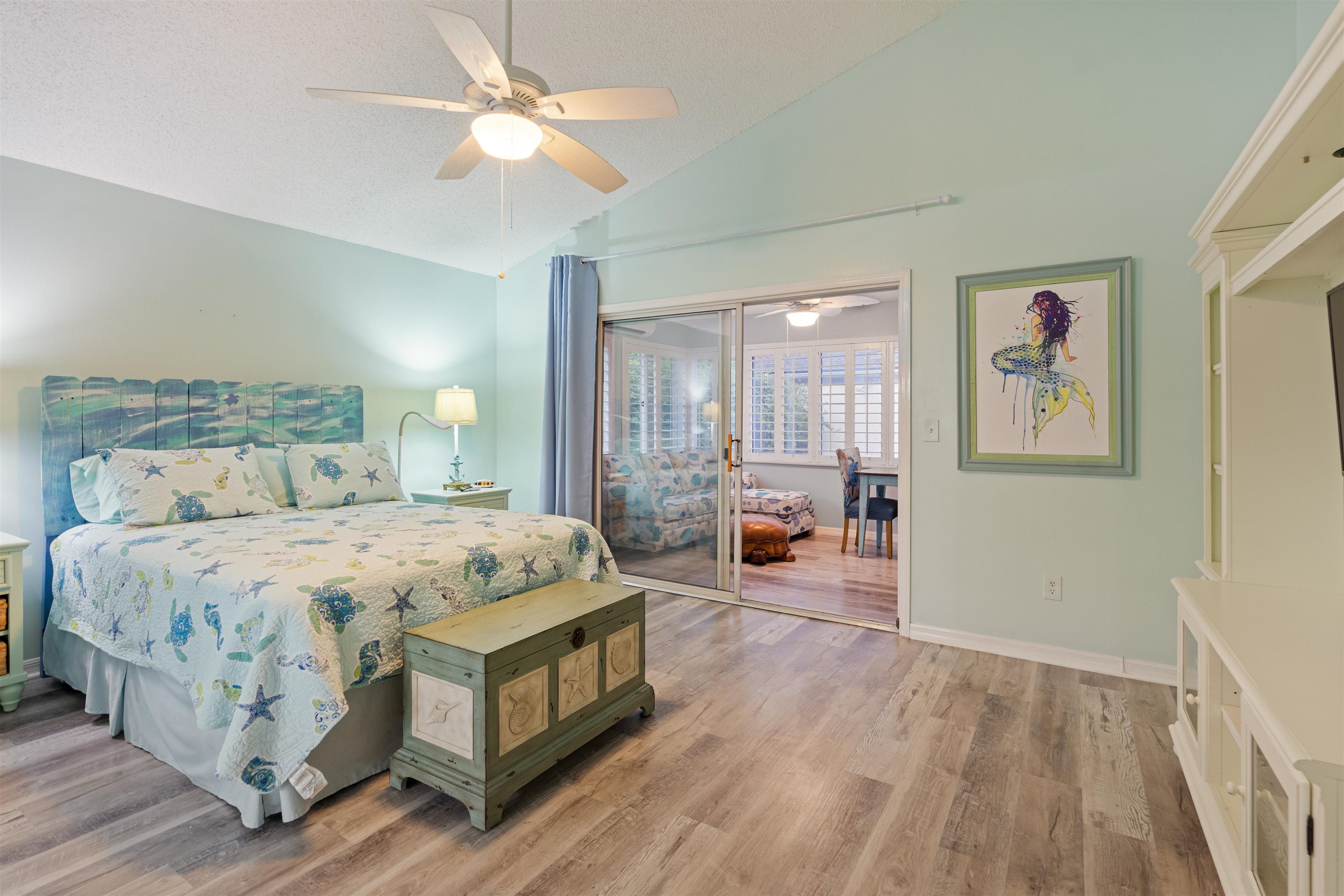 362 Monika Place St. Augustine, FL 32080 - Photo 11 of 42 a spacious bedroom with a bed and a chandelier
