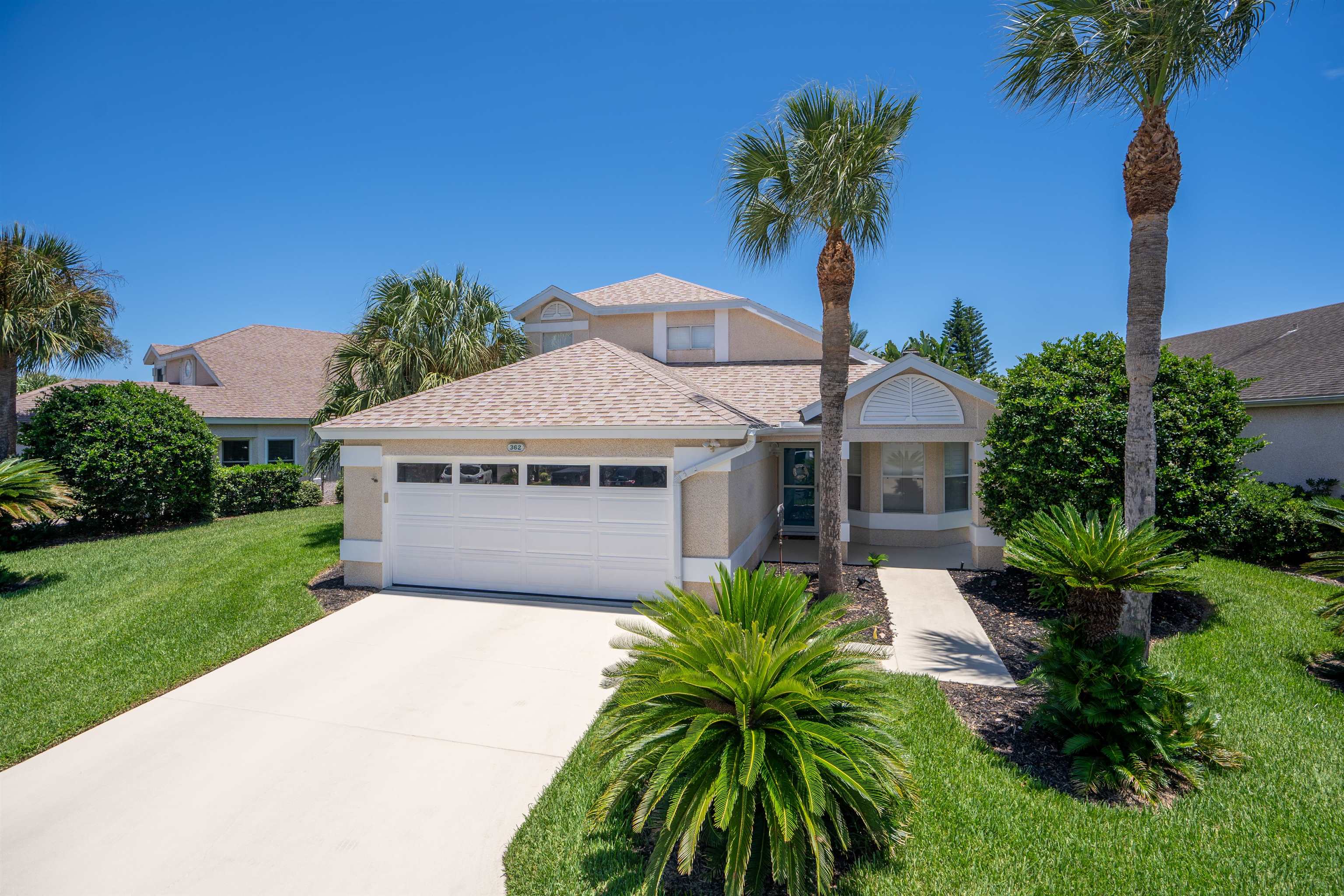 362 Monika Place St. Augustine, FL 32080 - Photo 2 of 42 a front view of a house with a garden