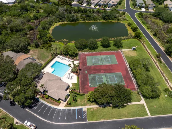 an aerial view of house with yard swimming pool and outdoor seating