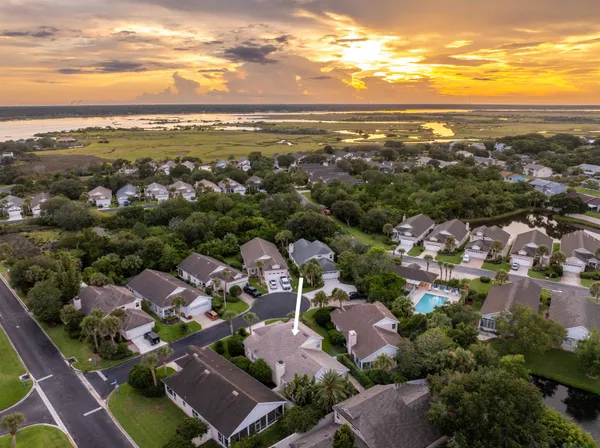 an aerial view of residential houses with outdoor space