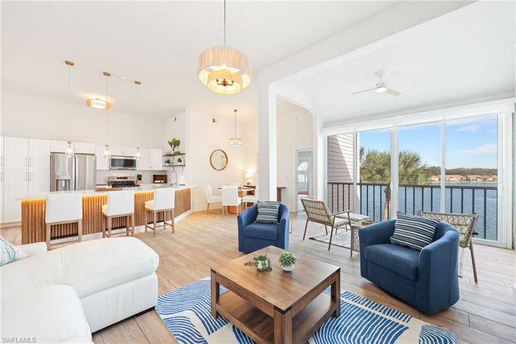 2711 Citrus Lake Drive, Unit F305 Naples, FL 34109 - Photo 11 of 50 a living room with furniture kitchen view and a large window