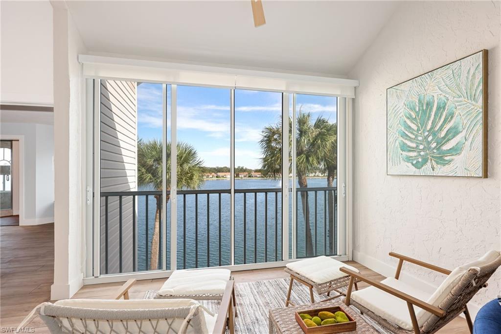 2711 Citrus Lake Drive, Unit F305 Naples, FL 34109 - Photo 12 of 50 a bedroom with a bed and a window