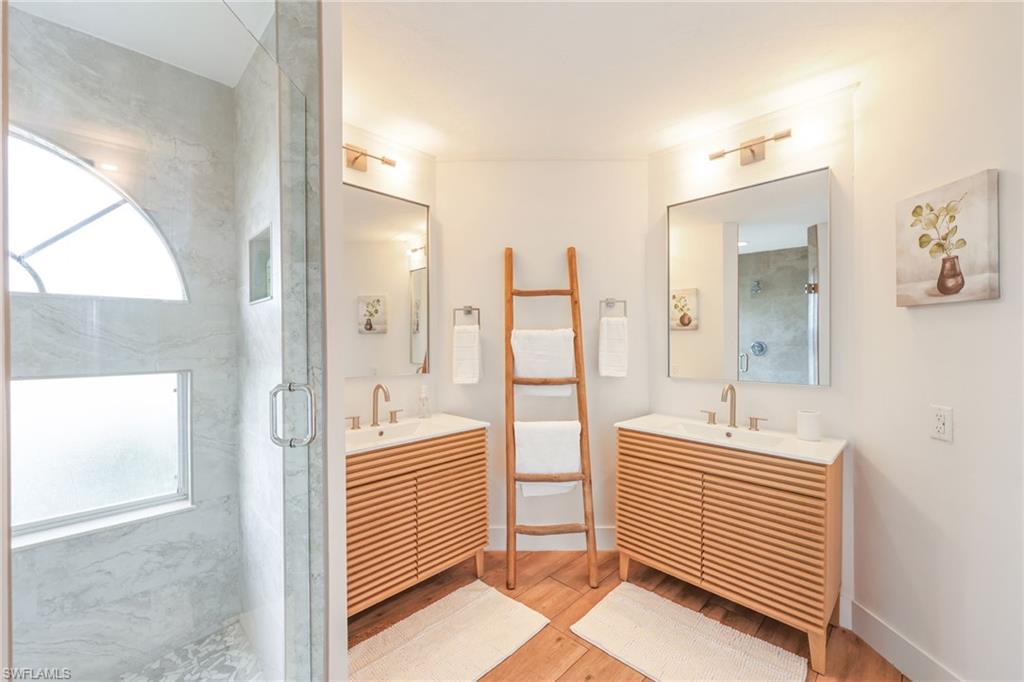 2711 Citrus Lake Drive, Unit F305 Naples, FL 34109 - Photo 27 of 50 a bathroom with a bathtub and a sink