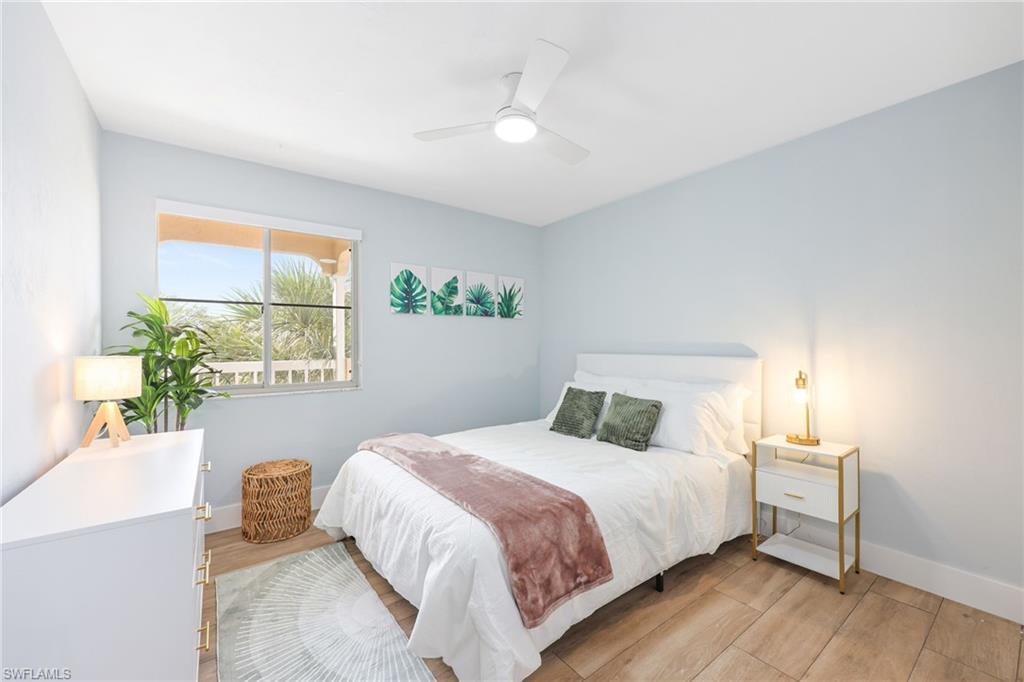 2711 Citrus Lake Drive, Unit F305 Naples, FL 34109 - Photo 33 of 50 a bedroom with a bed and a window
