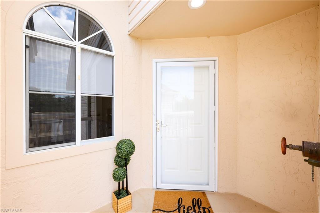 2711 Citrus Lake Drive, Unit F305 Naples, FL 34109 - Photo 35 of 50 a vase of flowers sitting on a floor