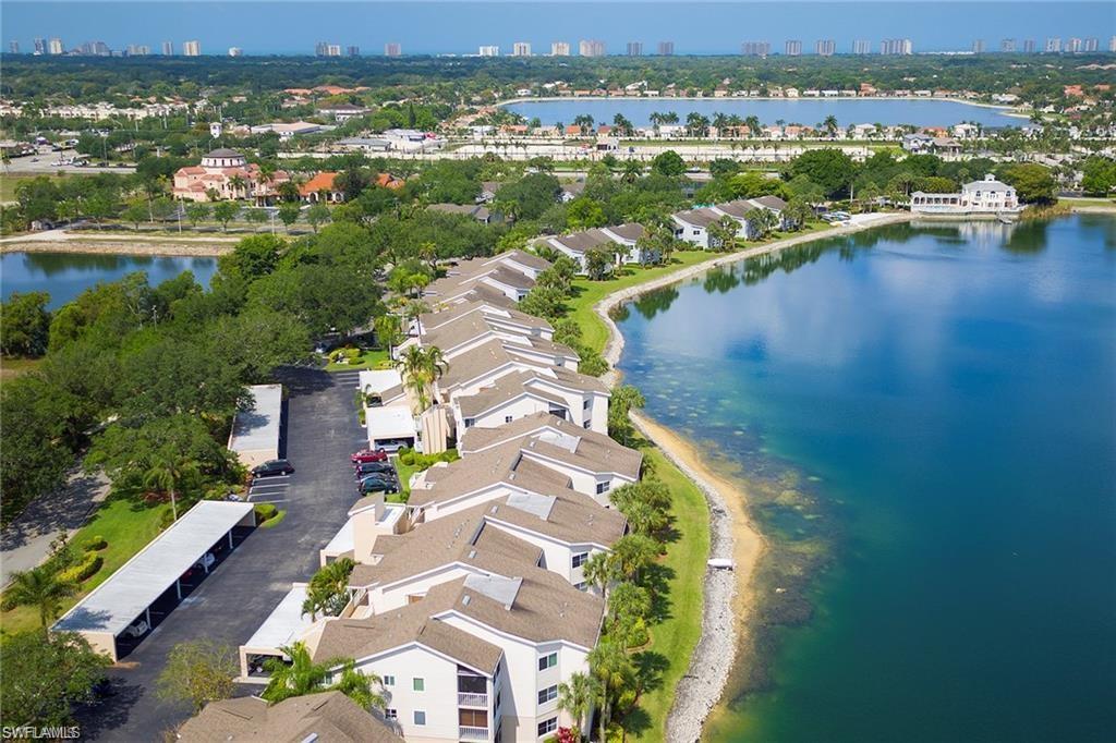 2711 Citrus Lake Drive, Unit F305 Naples, FL 34109 - Photo 48 of 50 an aerial view of residential houses with outdoor space and river